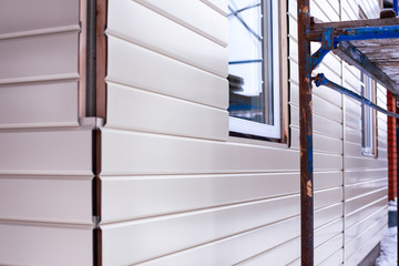 Gray corrugated metal siding on modern residential home