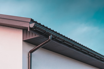 gutter services cleaning debris from roof gutters